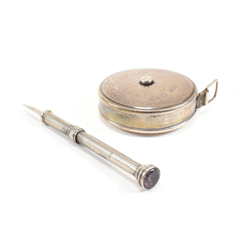 137 - A hallmarked Sampson and Mordan / J Rabone & Sons silver cased tape measure and a silver plated toot... 