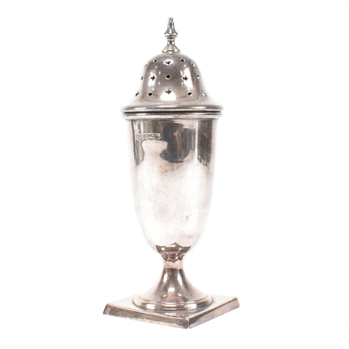 138 - A Mid Century hallmarked silver sugar caster. The sifter having a square base rising to plinth form.... 