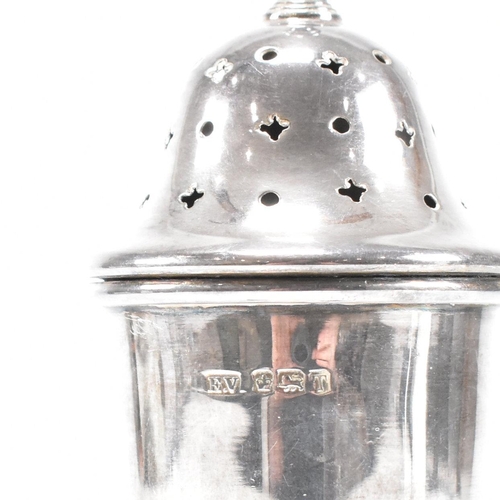 138 - A Mid Century hallmarked silver sugar caster. The sifter having a square base rising to plinth form.... 