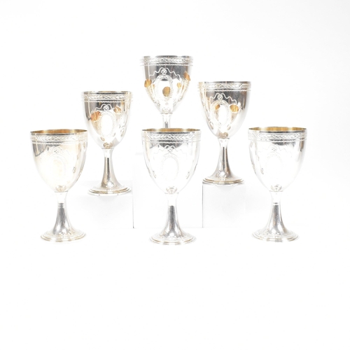 14 - Six 1970's hallmarked silver goblets. The six goblets each standing on a circular stepped plinth bas... 