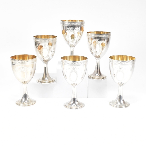 14 - Six 1970's hallmarked silver goblets. The six goblets each standing on a circular stepped plinth bas... 