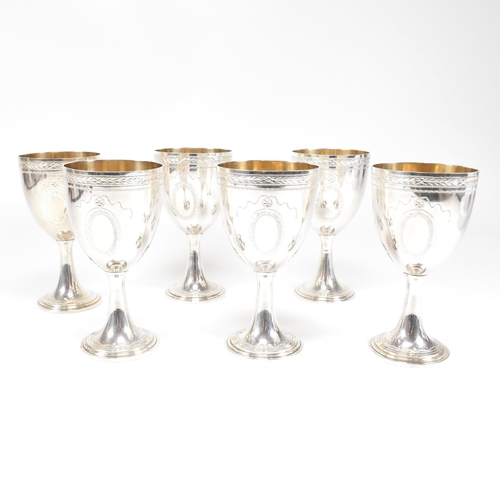 14 - Six 1970's hallmarked silver goblets. The six goblets each standing on a circular stepped plinth bas... 