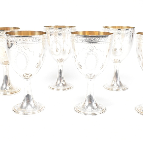 14 - Six 1970's hallmarked silver goblets. The six goblets each standing on a circular stepped plinth bas... 