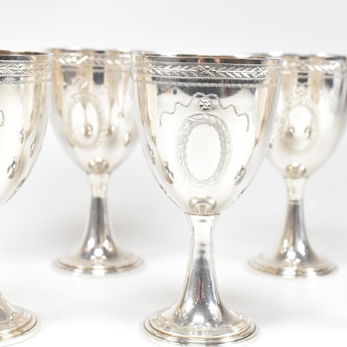 14 - Six 1970's hallmarked silver goblets. The six goblets each standing on a circular stepped plinth bas... 