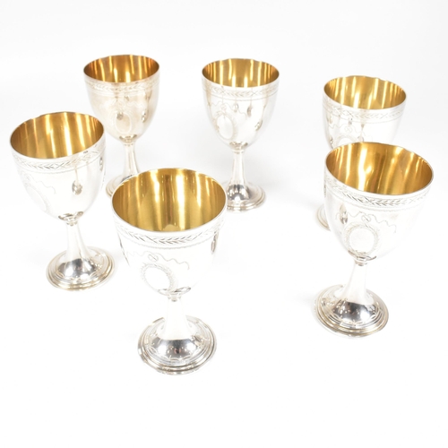 14 - Six 1970's hallmarked silver goblets. The six goblets each standing on a circular stepped plinth bas... 