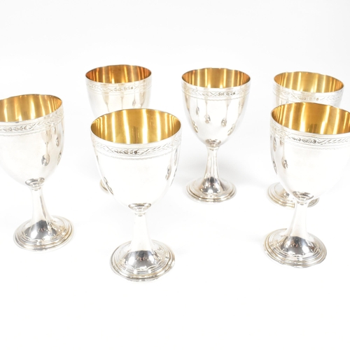 14 - Six 1970's hallmarked silver goblets. The six goblets each standing on a circular stepped plinth bas... 