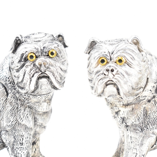 140 - An 800 silver novelty cruet set. The salt and pepper shakers being in the form of English bulldog do... 