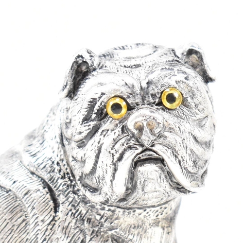 140 - An 800 silver novelty cruet set. The salt and pepper shakers being in the form of English bulldog do... 