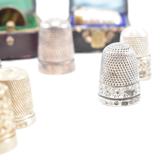 141 - A collection of fifteen hallmarked silver and white metal thimbles with five fitted cases. The lot t... 