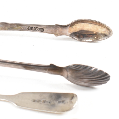 143 - A collection of hallmarked silver items. The lot to include a pair of George III sugar tongs. The Ge... 