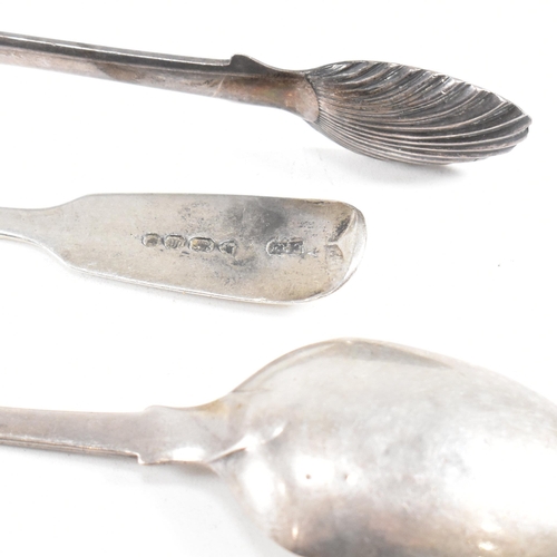 143 - A collection of hallmarked silver items. The lot to include a pair of George III sugar tongs. The Ge... 