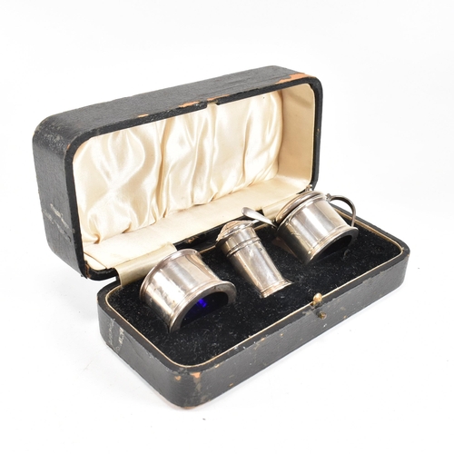 144 - A 1920's hallmarked silver cruet set. The George V three piece set consisting of a salt dish, pepper... 