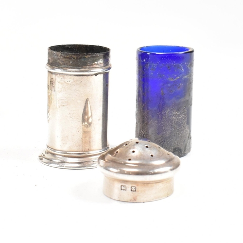 144 - A 1920's hallmarked silver cruet set. The George V three piece set consisting of a salt dish, pepper... 