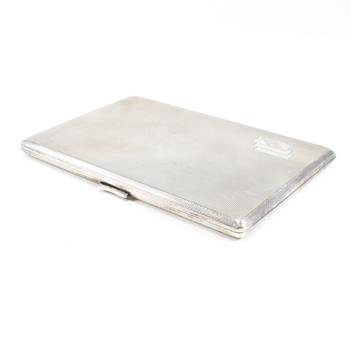 149 - A George V Hallmarked silver cigarette case. The case having an engine turned finish with monogramme... 