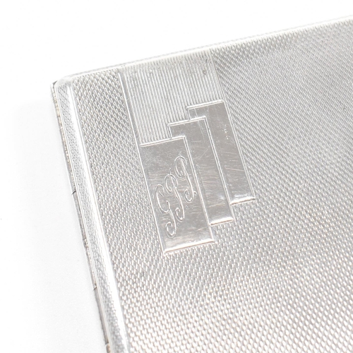 149 - A George V Hallmarked silver cigarette case. The case having an engine turned finish with monogramme... 