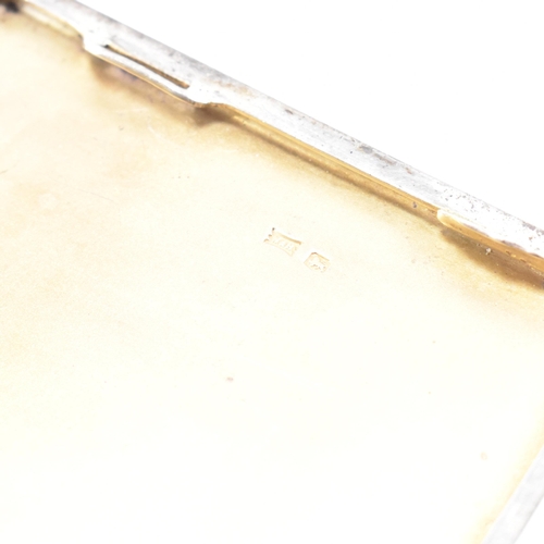 149 - A George V Hallmarked silver cigarette case. The case having an engine turned finish with monogramme... 