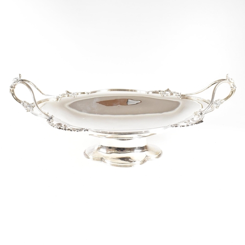 154 - A George V hallmarked silver fruit bowl. The bowl having a plinth base raising to oval form with rel... 