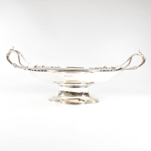 154 - A George V hallmarked silver fruit bowl. The bowl having a plinth base raising to oval form with rel... 