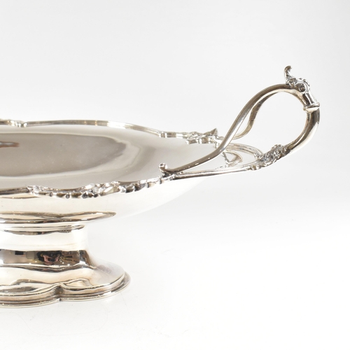 154 - A George V hallmarked silver fruit bowl. The bowl having a plinth base raising to oval form with rel... 