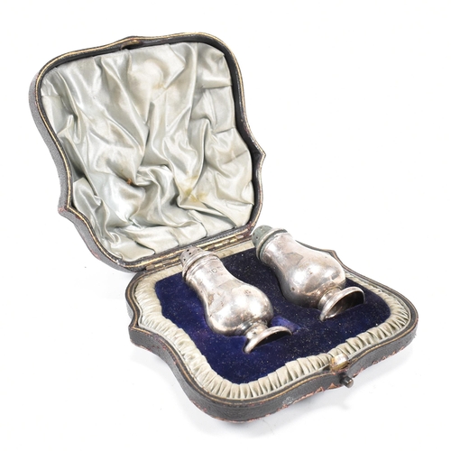 157 - A Victorian cased hallmarked silver cruet set. The set comprising of a salt and pepper shaker each o... 