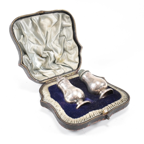 157 - A Victorian cased hallmarked silver cruet set. The set comprising of a salt and pepper shaker each o... 