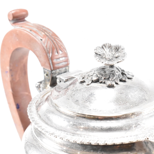 16 - A 1950s hallmarked silver coffee and tea pot set. The pair both standing on four hoof feet with scro... 