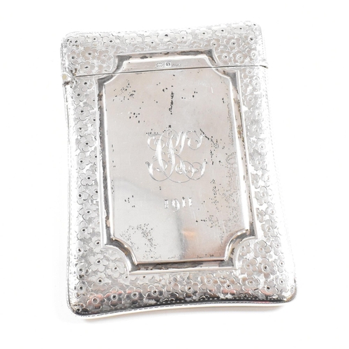 162 - An Edward VII hallmarked silver card case. The Edwardian case having an etched floral boarder design... 