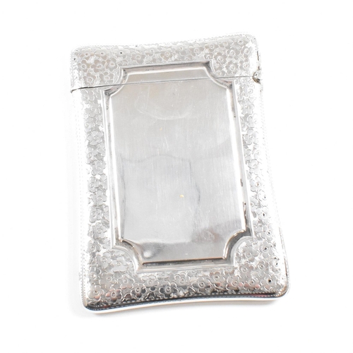 162 - An Edward VII hallmarked silver card case. The Edwardian case having an etched floral boarder design... 