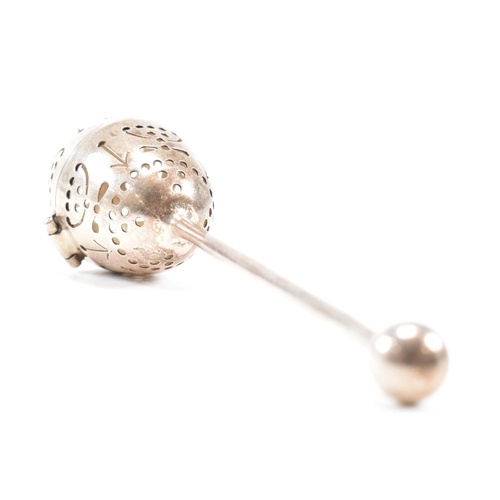 167 - A Victorian hallmarked silver tea infuser of egg form.The infuser having an egg shaped pierced infus... 