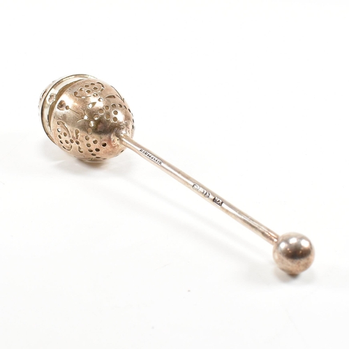 167 - A Victorian hallmarked silver tea infuser of egg form.The infuser having an egg shaped pierced infus... 