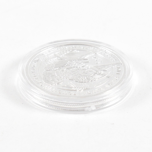 168 - A one oz 2011 Royal Silver Company coin. The coin being marked plata extra-fina .99999 silver. The c... 