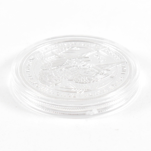 168 - A one oz 2011 Royal Silver Company coin. The coin being marked plata extra-fina .99999 silver. The c... 