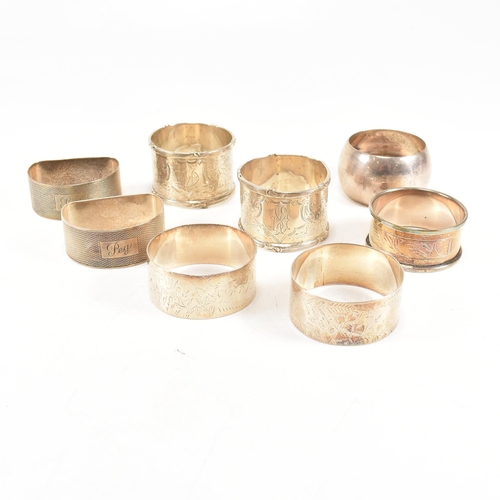 170 - A collection of eight hallmarked silver napkin rings. The lot to include a pair with etched scrolled... 