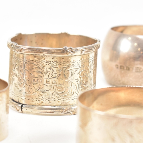 170 - A collection of eight hallmarked silver napkin rings. The lot to include a pair with etched scrolled... 