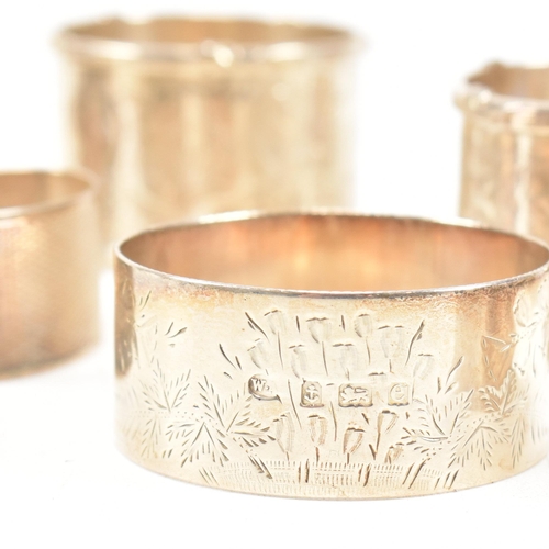 170 - A collection of eight hallmarked silver napkin rings. The lot to include a pair with etched scrolled... 