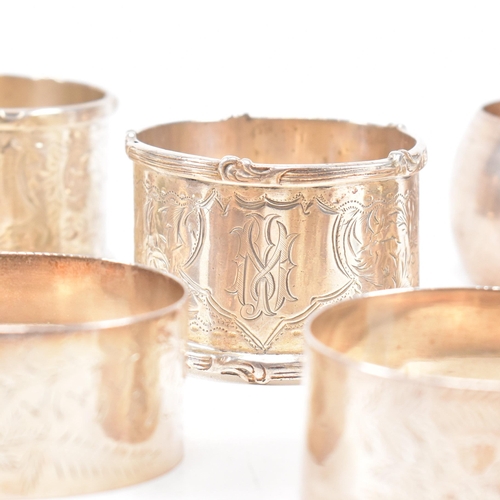 170 - A collection of eight hallmarked silver napkin rings. The lot to include a pair with etched scrolled... 