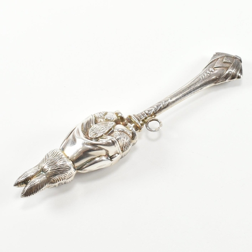 179 - A hallmarked silver rabbit rattle teether. The rattle in the form of a rabbit having a ribbon bale t... 