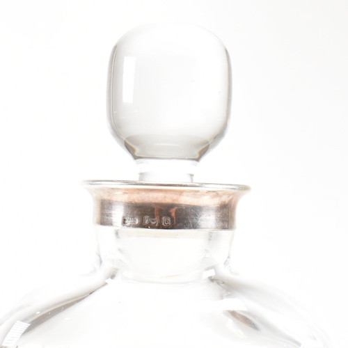 18 - A Portuguese Topazio Casquinha crystal decanter. The continental decanter having a silver plated col... 