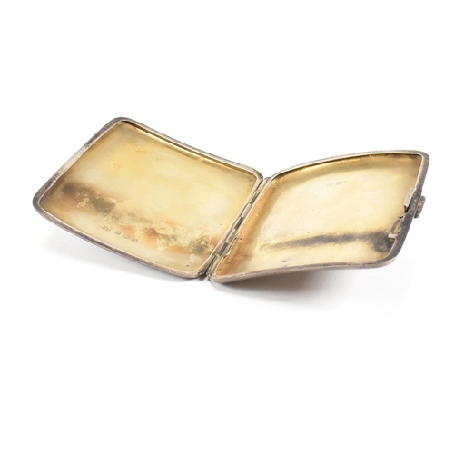 188 - A 1920s hallmarked silver cigarette case and a silver ashtray. The George V cigarette case having an... 