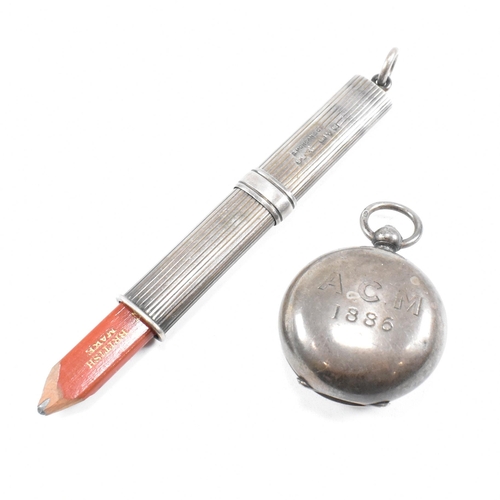 19 - A hallmarked silver propelling pencil and sovereign holder. The Sampson Mordan & Co hallmarked silve... 