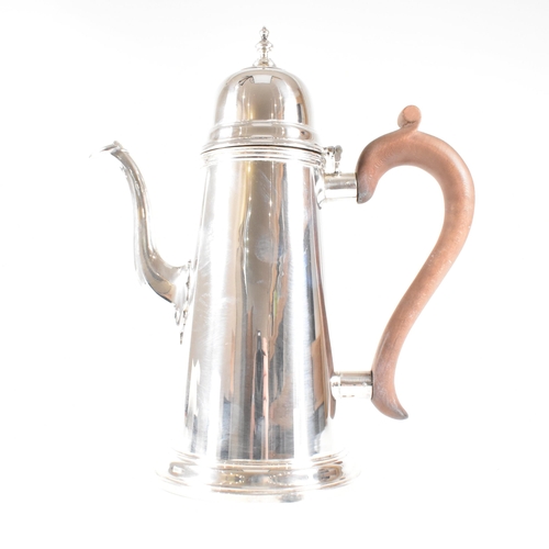 192 - A hallmarked silver Queen Anne style coffee pot. The coffee pot in round tapered form having a domed... 