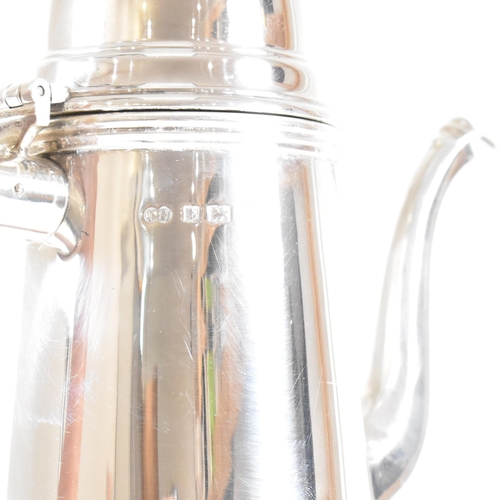 192 - A hallmarked silver Queen Anne style coffee pot. The coffee pot in round tapered form having a domed... 