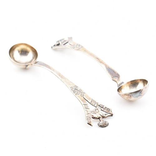 194 - A pair of Anglo-colonial Indian silver condiment ladles. Each with pierced handles having elephant a... 