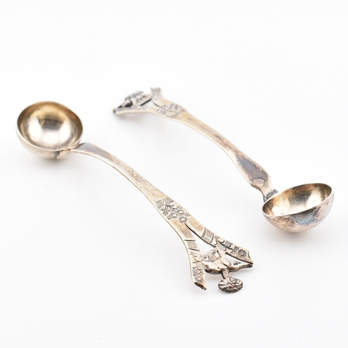 194 - A pair of Anglo-colonial Indian silver condiment ladles. Each with pierced handles having elephant a... 