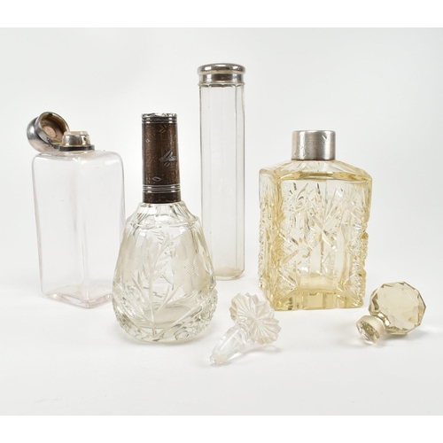 198 - A collection of silver four hallmarked cut glass ladies dressing table vanity bottles, perfume and p... 