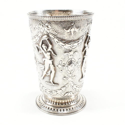 200 - A 19th century Victorian silver mug cast in relief with figures, swag and harebell surrounding an ar... 