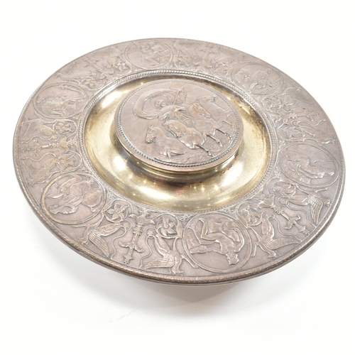 202 - A 19th century Victorian Elkington & Co ink stand. The ink stand of circular form decorated with neo... 