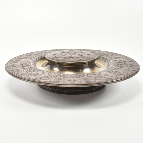 202 - A 19th century Victorian Elkington & Co ink stand. The ink stand of circular form decorated with neo... 