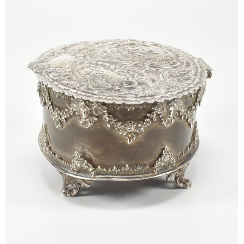 205 - A Victorian hallmarked silver and tortoiseshell trinket jewellery box. The box having a repouss dec... 