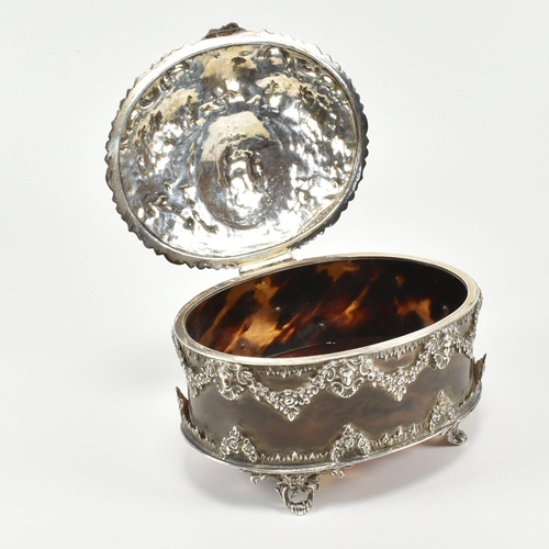 205 - A Victorian hallmarked silver and tortoiseshell trinket jewellery box. The box having a repouss dec... 